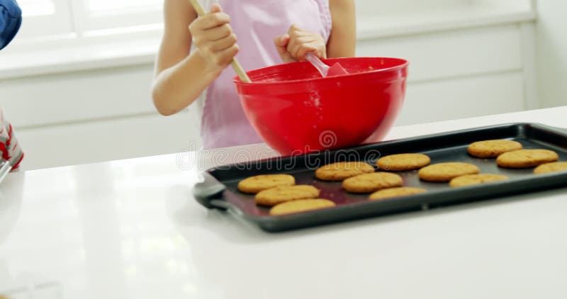 Girl mixing dough in bowl