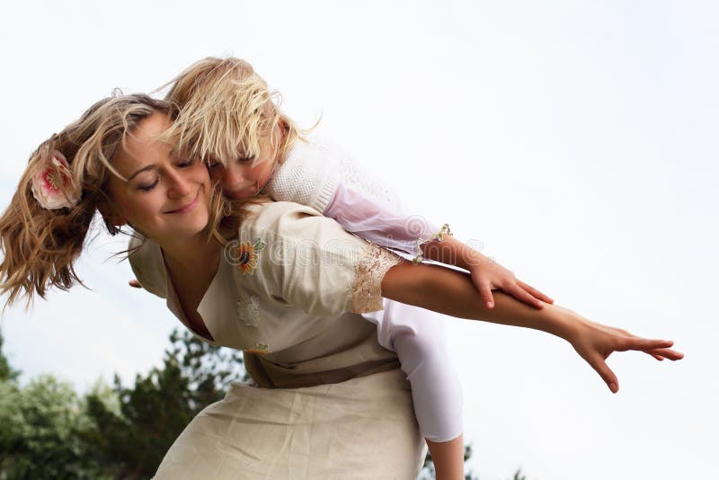 Girl with mother in the park