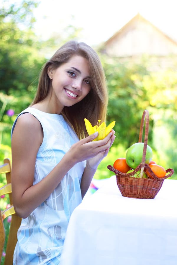 Girl on the nature of fruit