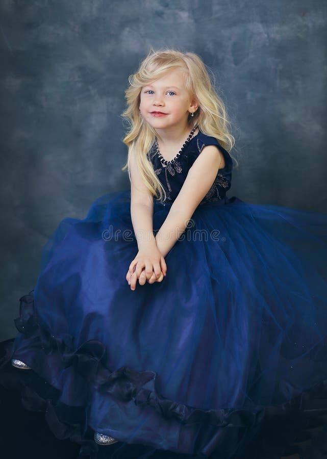 Girl in navy blue dress stock photography Girl in navy blue dress stock photography