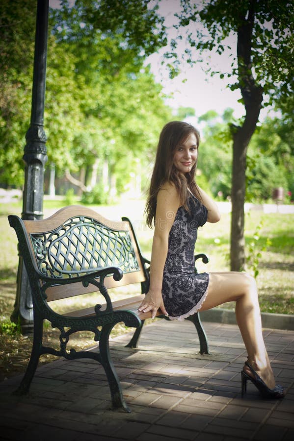 Girl near green tree