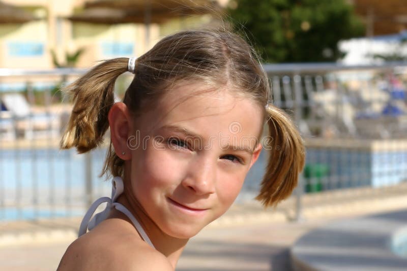 Girl near the swimming pool