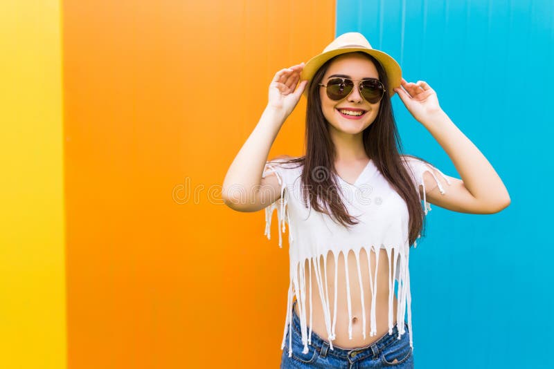 Girl with nice body against color wall background