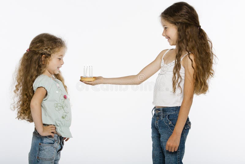 Girl offering bithday cake