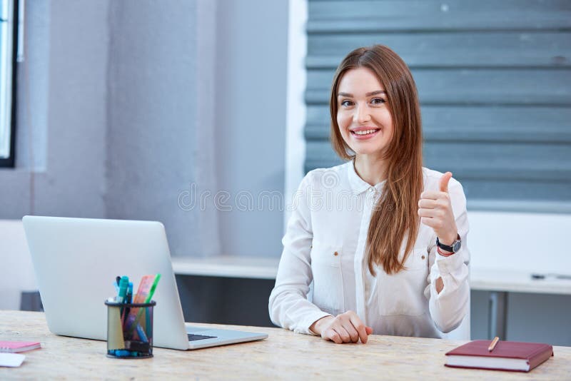 Girl Office Worker Sitting in Headphones, Smiling and Showing Thumb Up.  Stock Image - Image of computer, people: 106665747