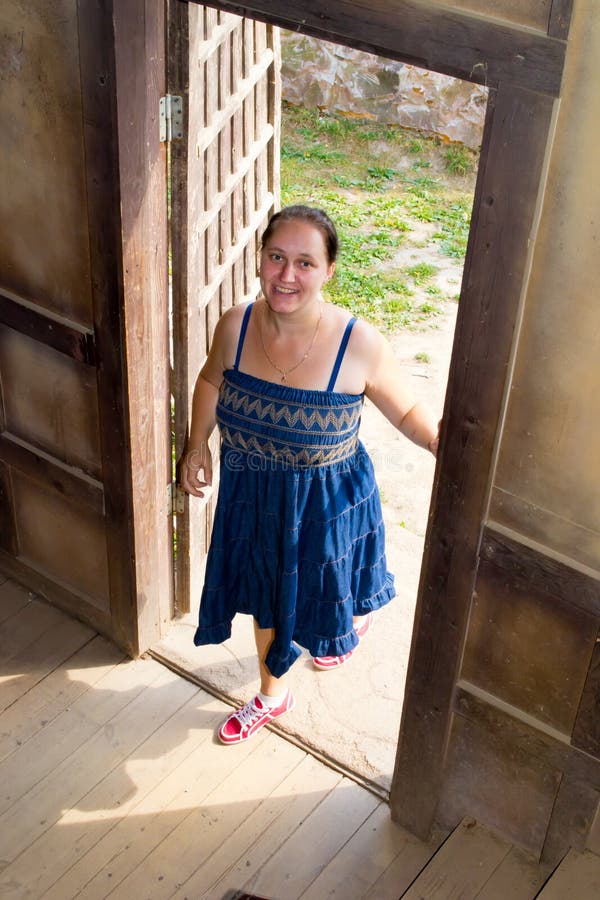 The girl opens the door royalty free stock photography The girl opens the door royalty free stock photography