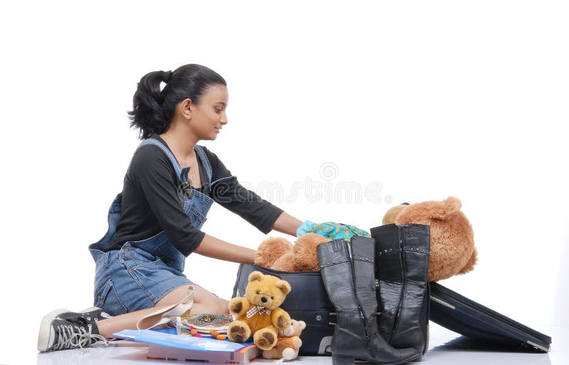 Girl Packing Clothes Image & Photo (Free Trial)