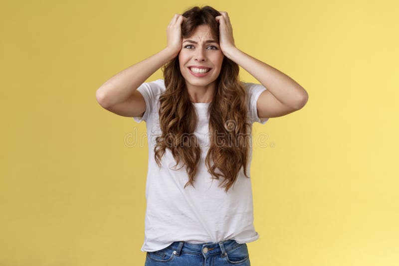 Girl panicking huge trouble suffer panic-attack grimacing painful feelings inside hold hands head troubled frustrated frowning anxiously staring camera troublesome problematic situation.