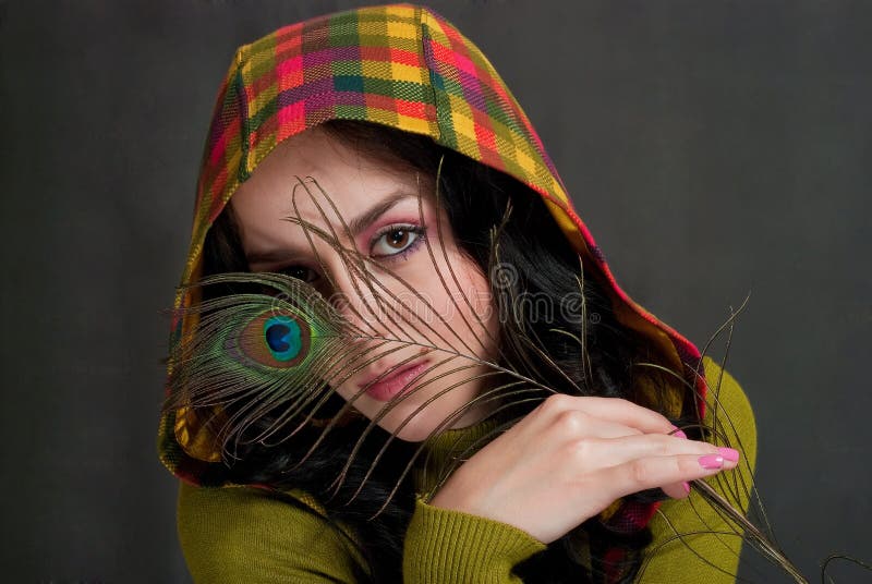 Girl with peacock feather royalty free stock photos