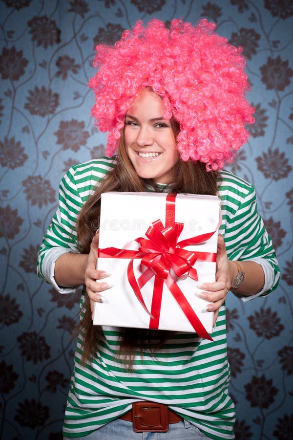 Girl in pink wig with gift