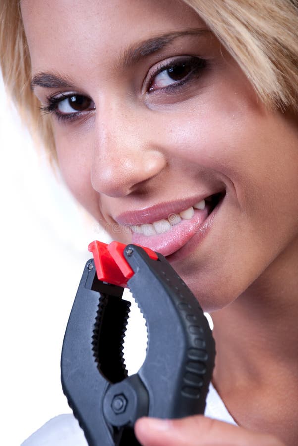 Girl with plastic clamp on her tongue