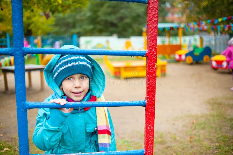 The girl on the playground stock photography