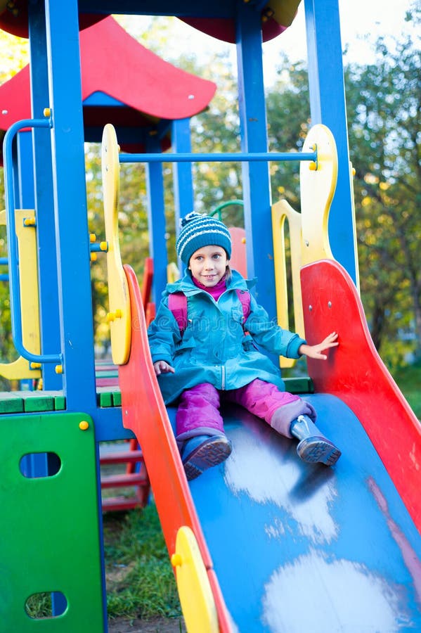 The girl on the playground stock images