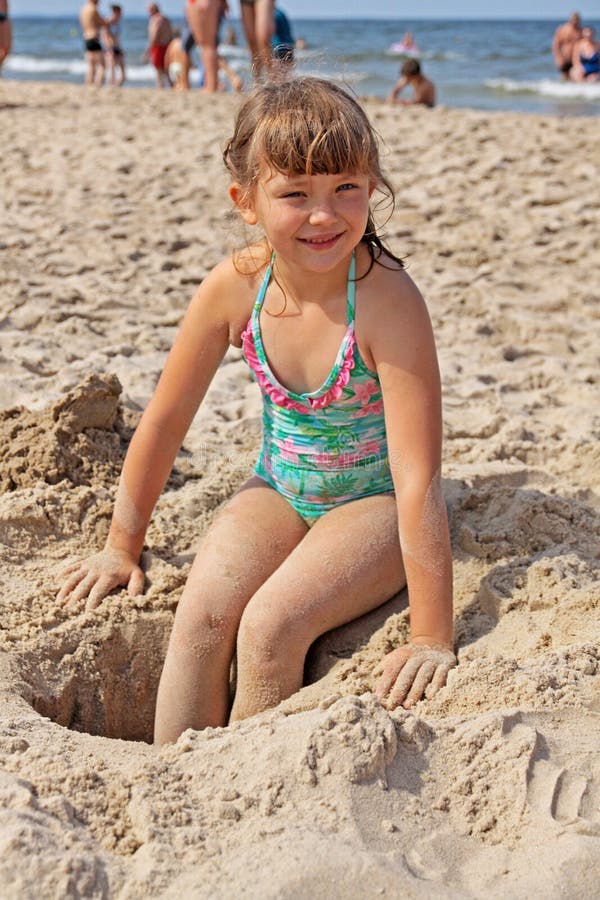 Girl playing on the beach