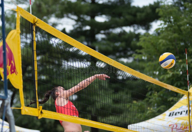 Girl playing beach volleyball