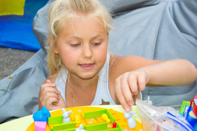 Girl playing a board game