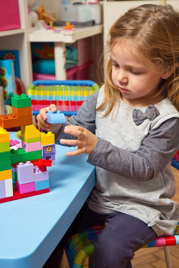 Girl is Playing with Building Bricks Stock Image - Image of bricks ...