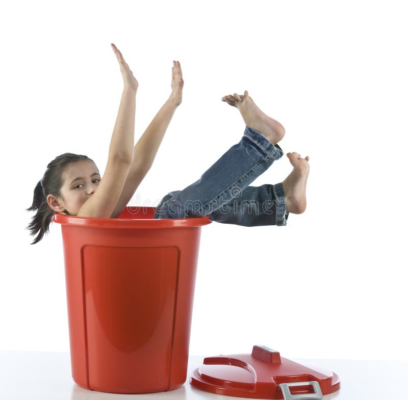 Girl playing with red bin