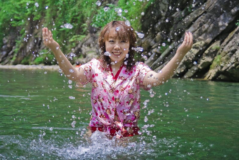 A girl playing water