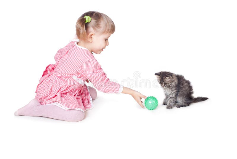 The girl plays with a kitten royalty free stock photos