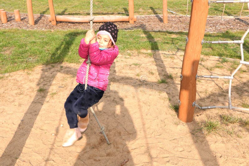 The Girl Plays on the Playground in the Fall Stock Image - Image of ...