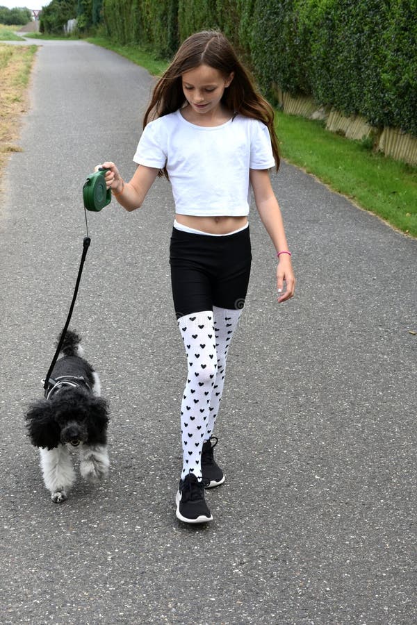 Girl and poodle dog