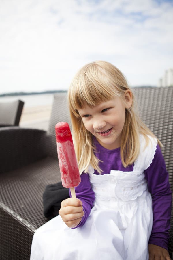 Girl with popsicle stock image. Image of taste, cold 26567177