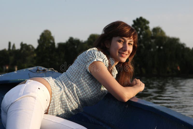 Girl posing on a boat