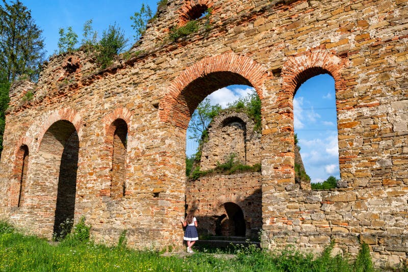 Girl posing in technical ruin. Iron Smelting Plant called Frantiskova Huta in Slovakia royalty free stock image Girl posing in technical ruin. Iron Smelting Plant called Frantiskova Huta in Slovakia royalty free stock image