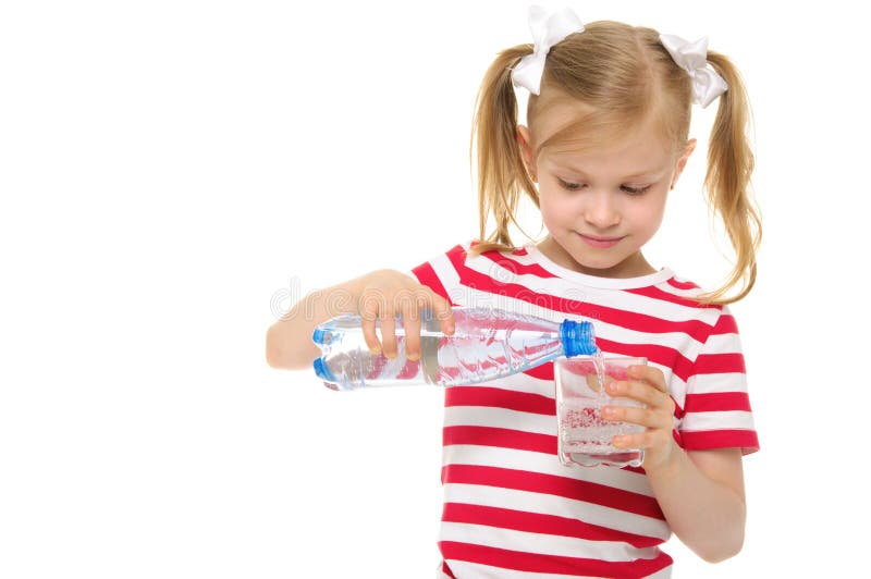 Girl pours water from bottle into glass