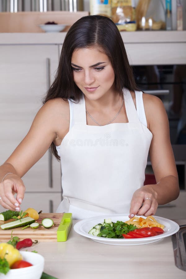 Girl prepares salad