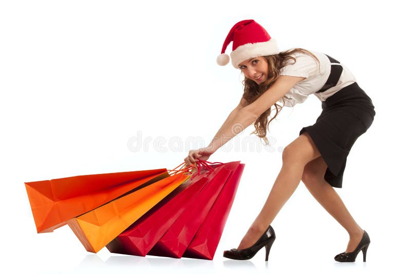 Girl pulling christmas shopping bags