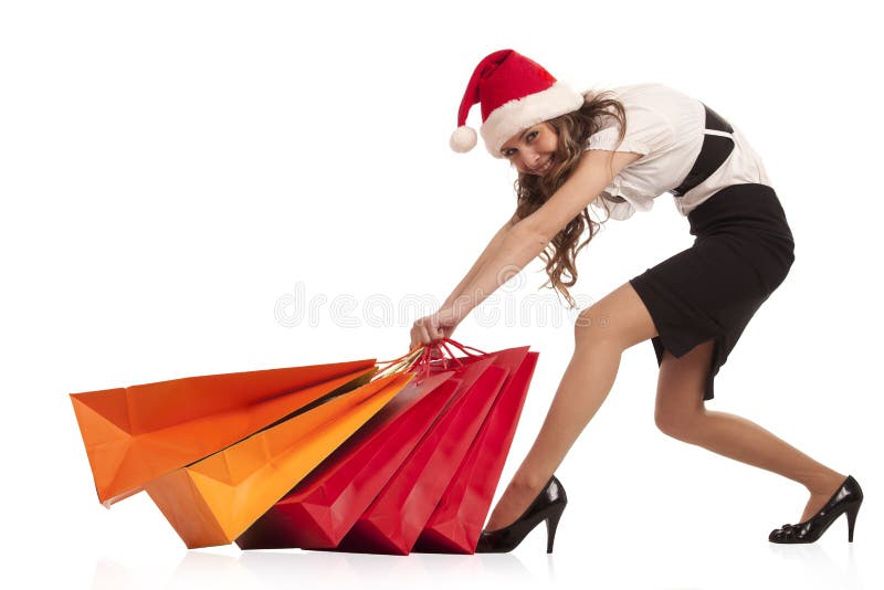 Girl pulling christmas shopping bags