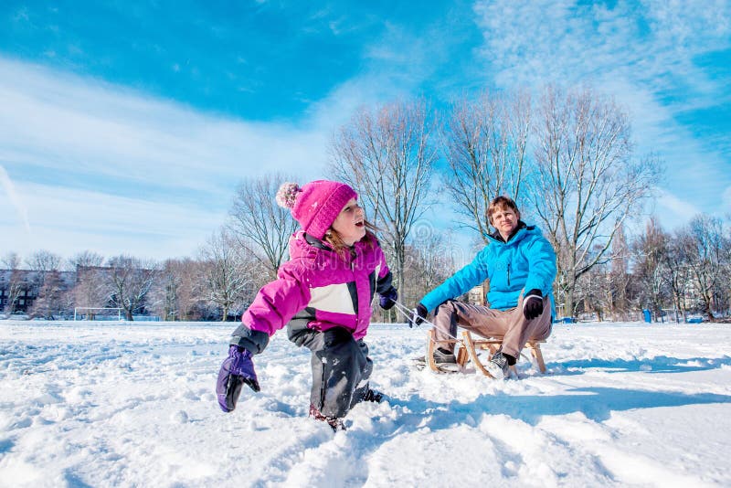 Girl pulling sledges