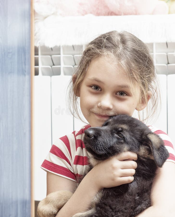 Girl and puppy stock photo. Image of smiling, happiness - 69520888