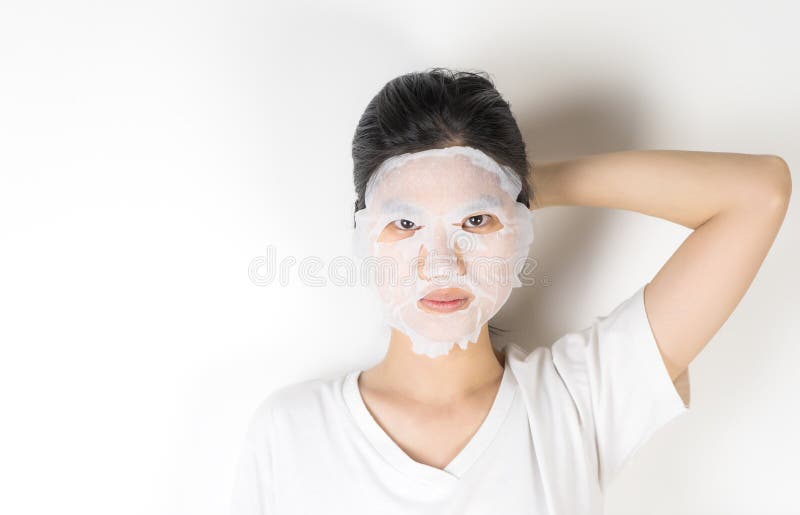Girl in Putting on a Skin Care Paper Mask Stock Photo - Image of