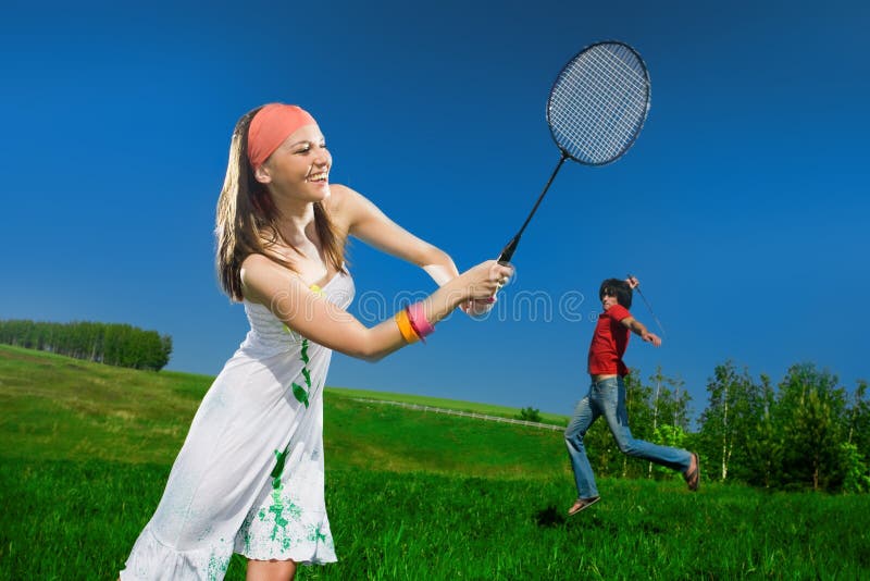 Girl with racket and boy