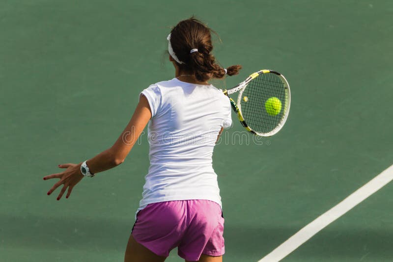 Girl Tennis Hits Ball stock images