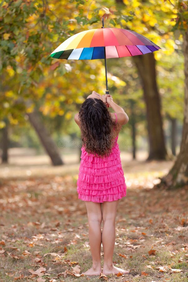 Girl with rainbow umbrella stock image. Image of outdoor 16456537