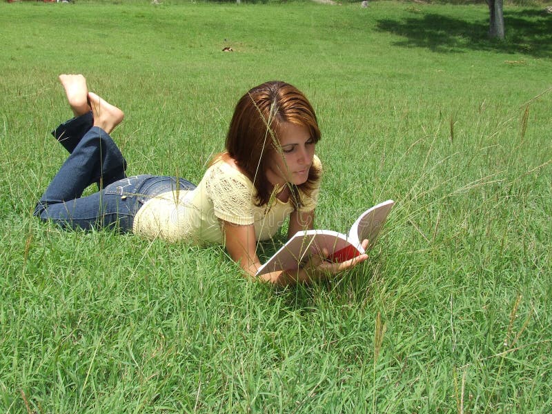 Girl reading on the grass