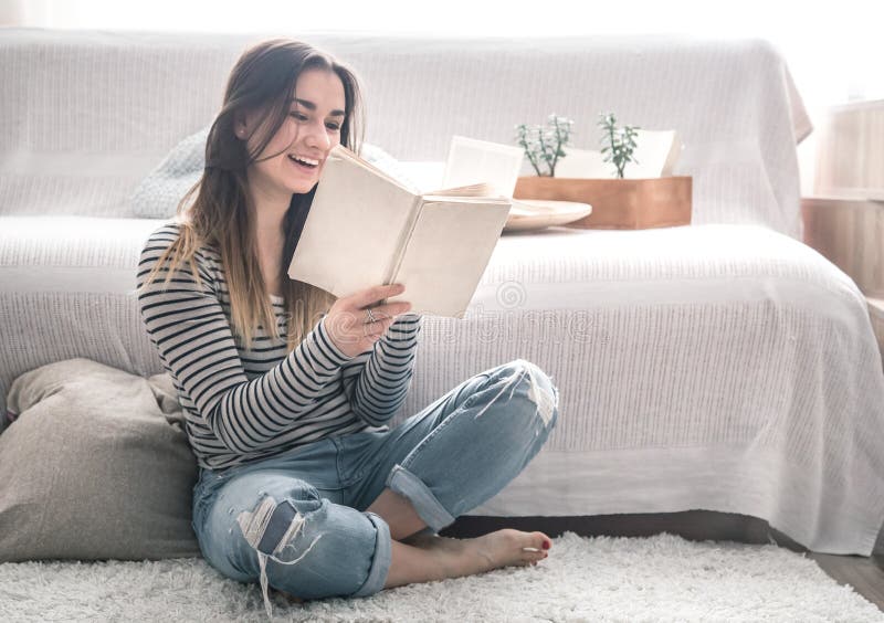 A Girl Reading In The Living Room