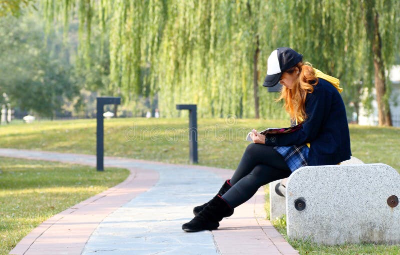 Girl reading in park..