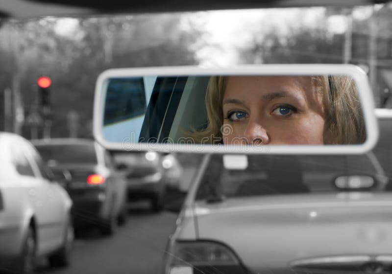 Girl in rearview mirror stock photos