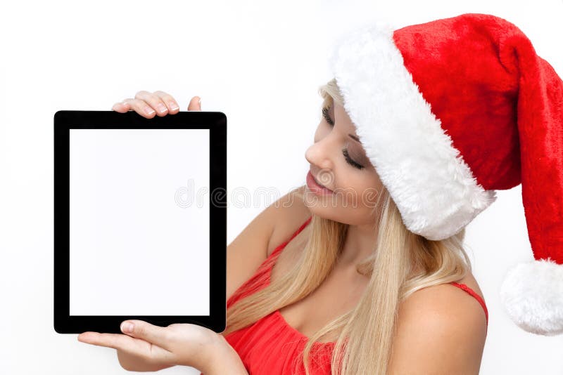 Girl in a red Christmas hat holding tablet