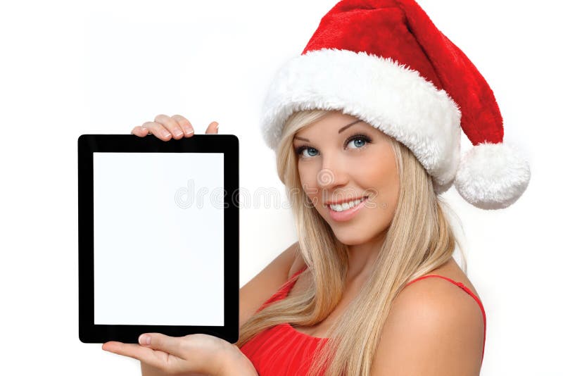 Girl in a red Christmas hat, holding tablet touch