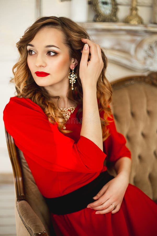 black dress with red jewelry