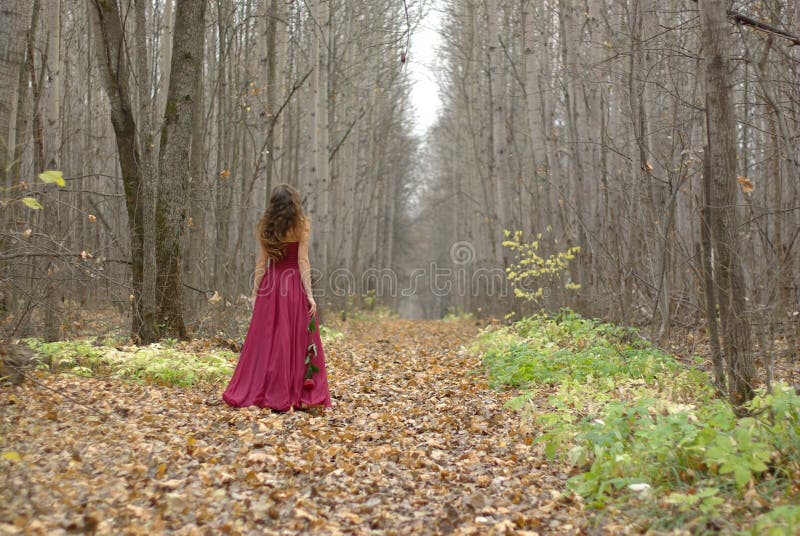 Girl in red dress walking