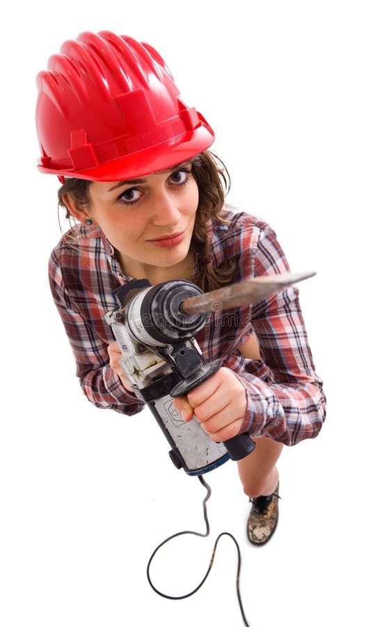 Girl in red helmet with drill looking up