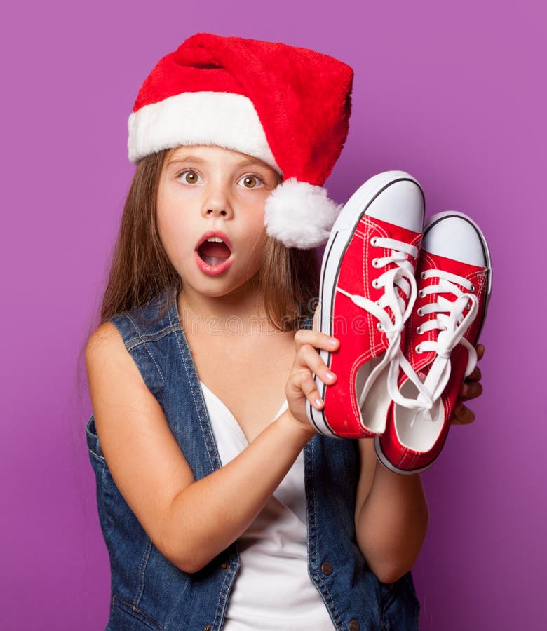 Girl in Red Santas Hat with Gumshoes Stock Photo - Image of attractive ...