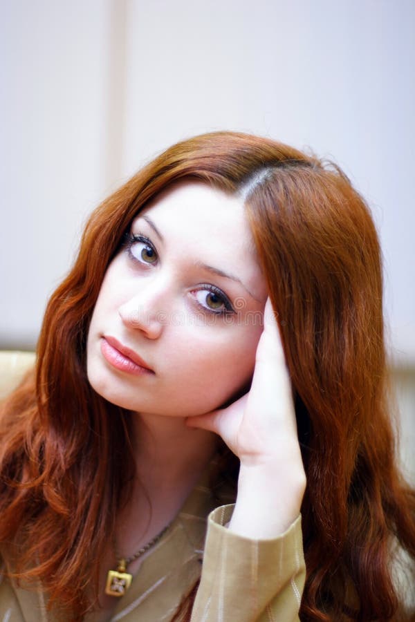 Girl with reddish hair in office